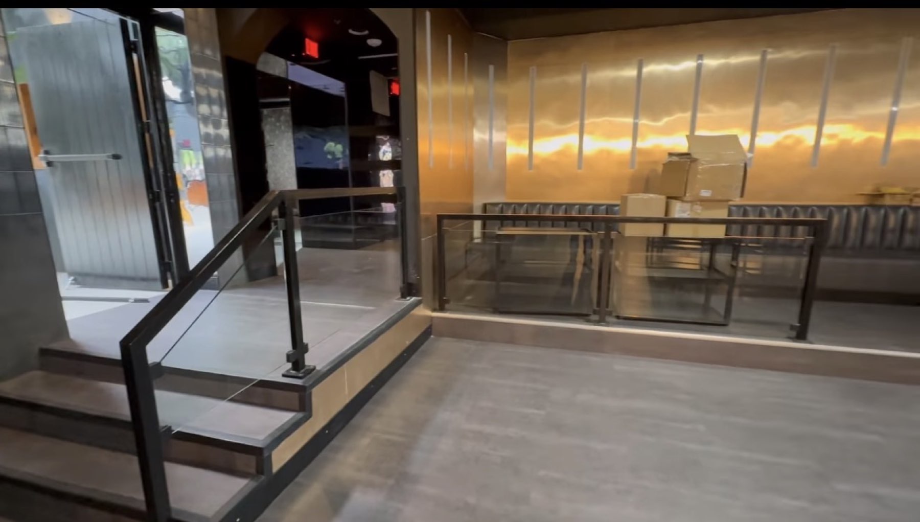 Custom steel and glass railing fabricated by American Spirit Welding