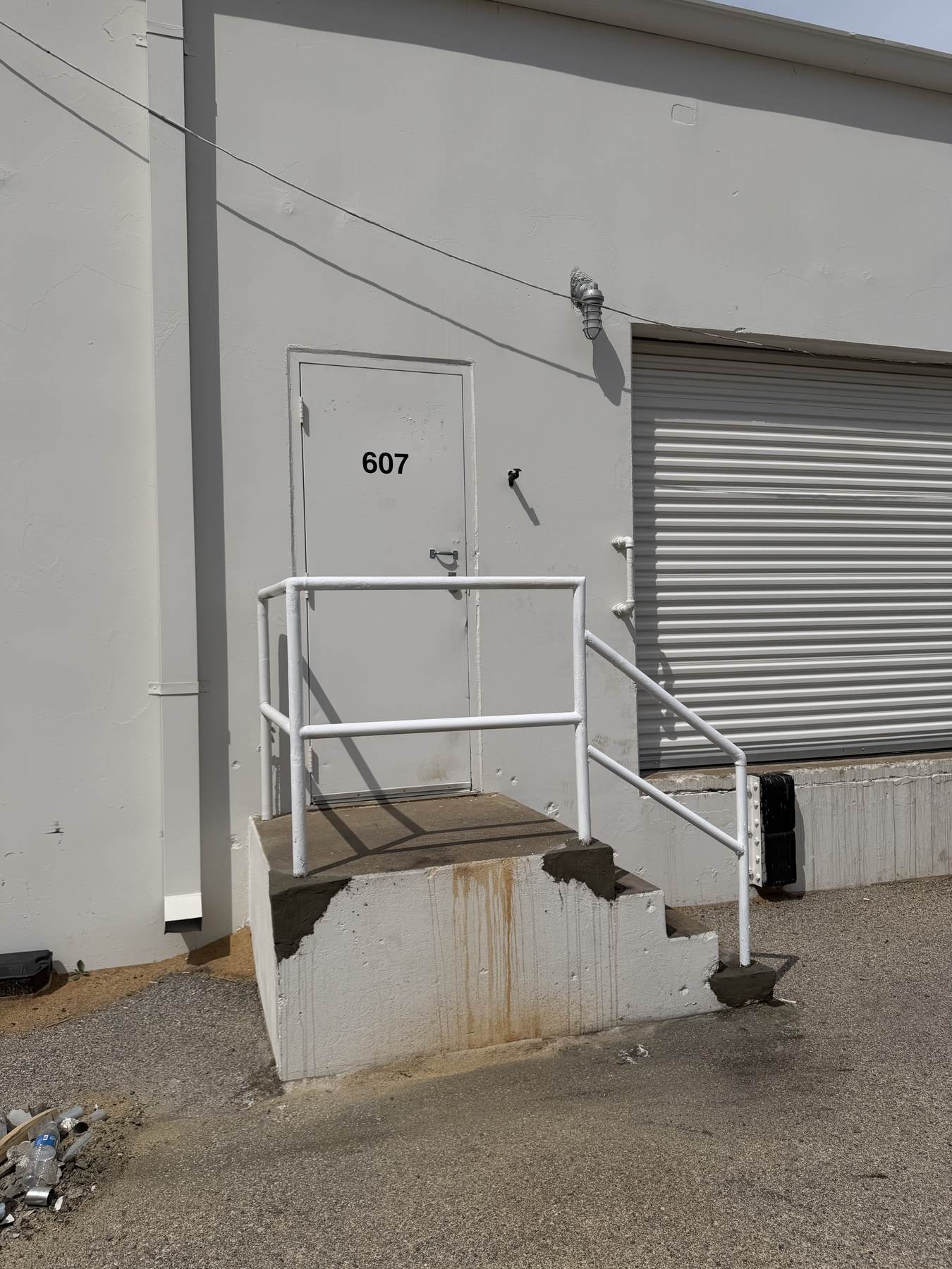 Exterior steel stair and hatch access installed on a commercial building